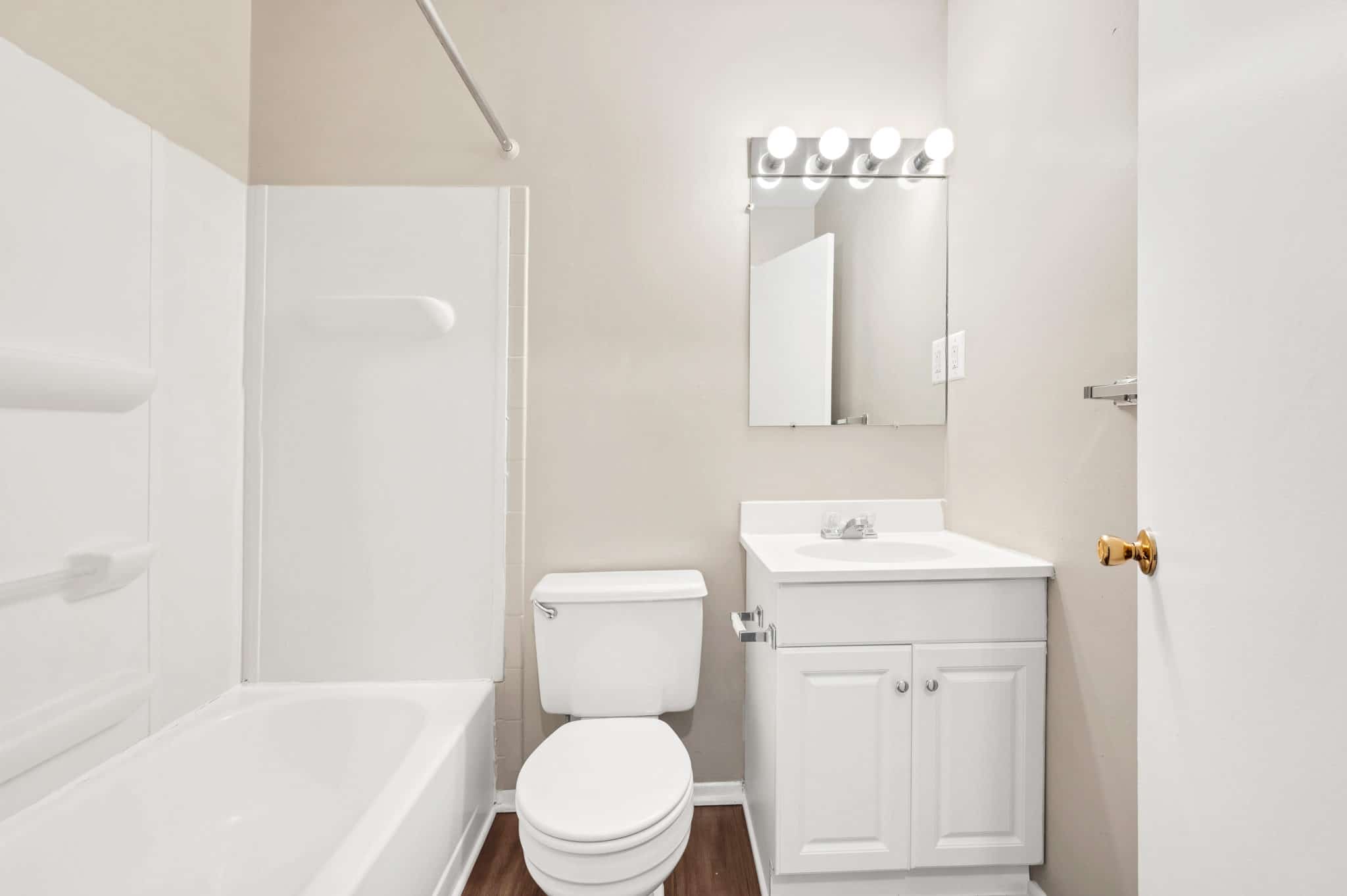 bathroom with tub and shower | Spark Waldorf Apartments