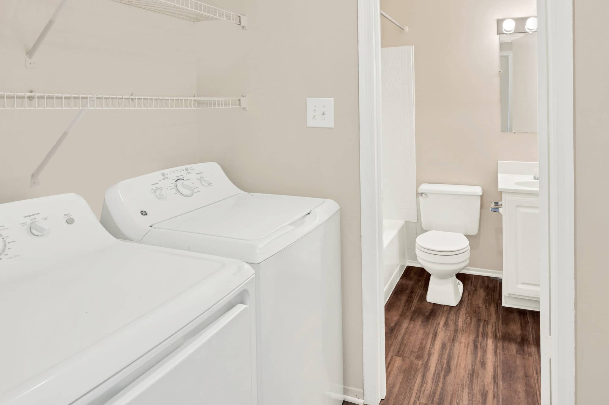 laundry room adjacent to bathroom | Spark Waldorf Apartments