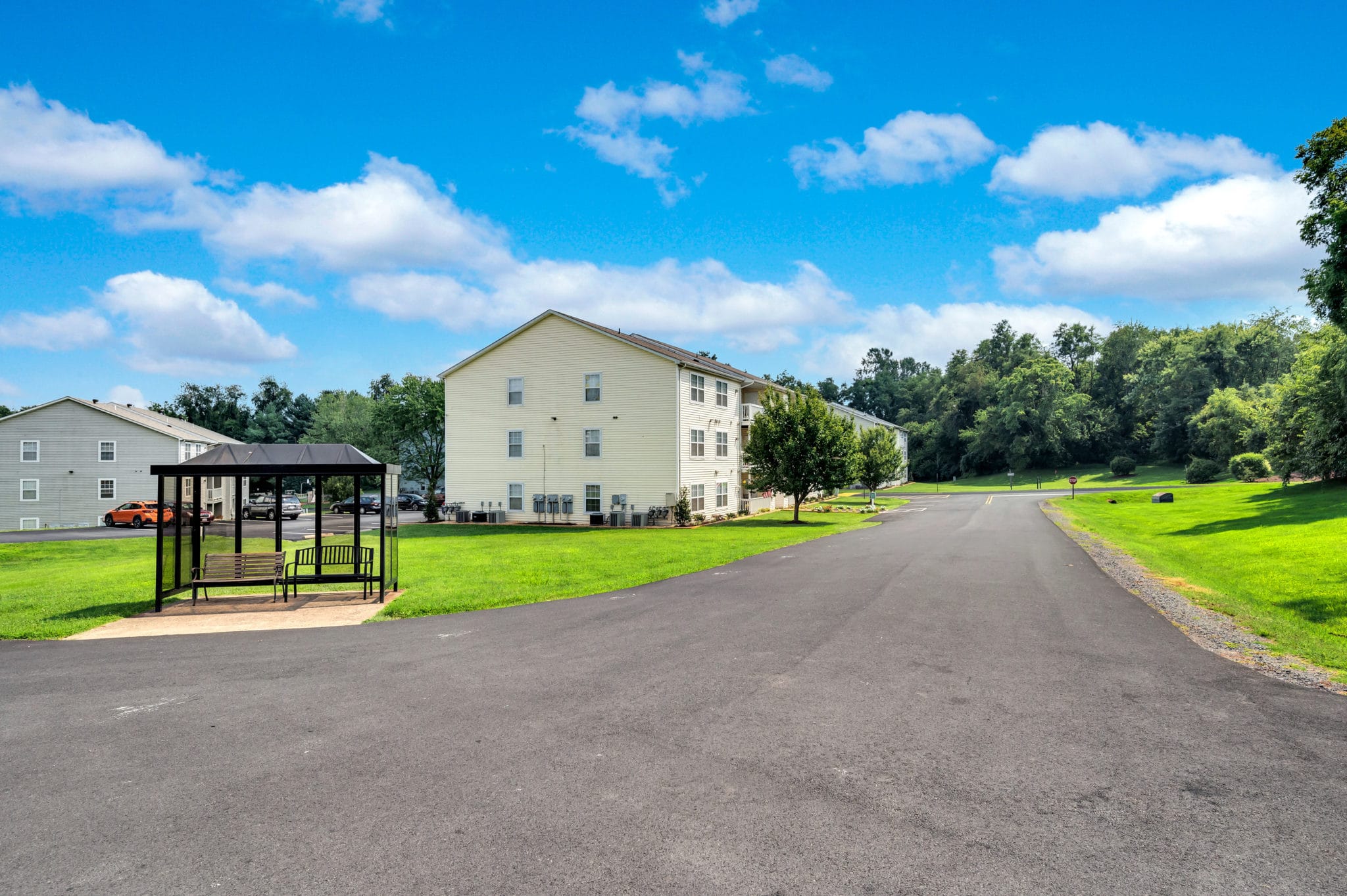 apartment exterior and bus stop | Spark Culpeper apartments