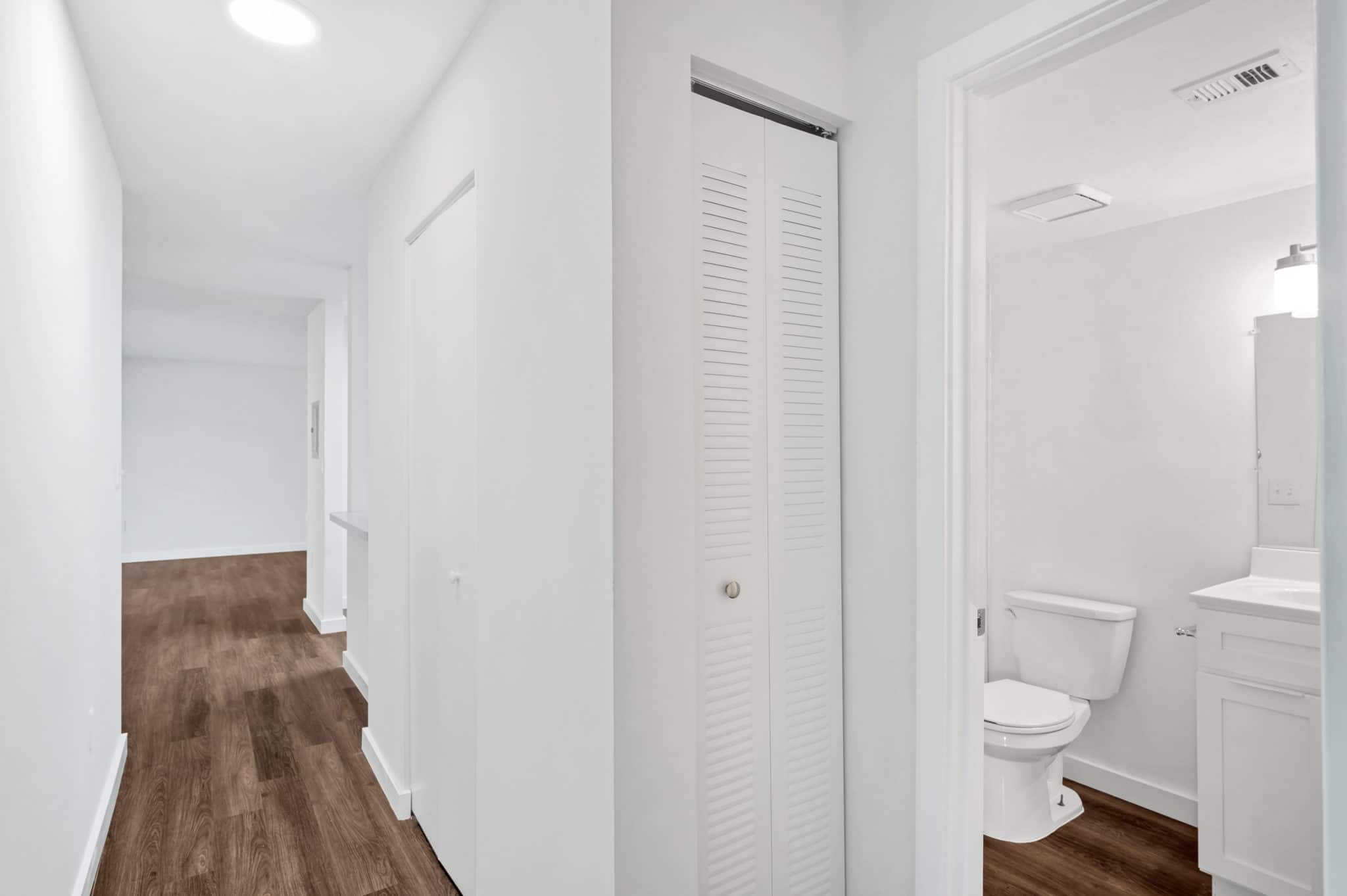 bathroom and linen closet in hallway | Spark Oxon Hill Apartments