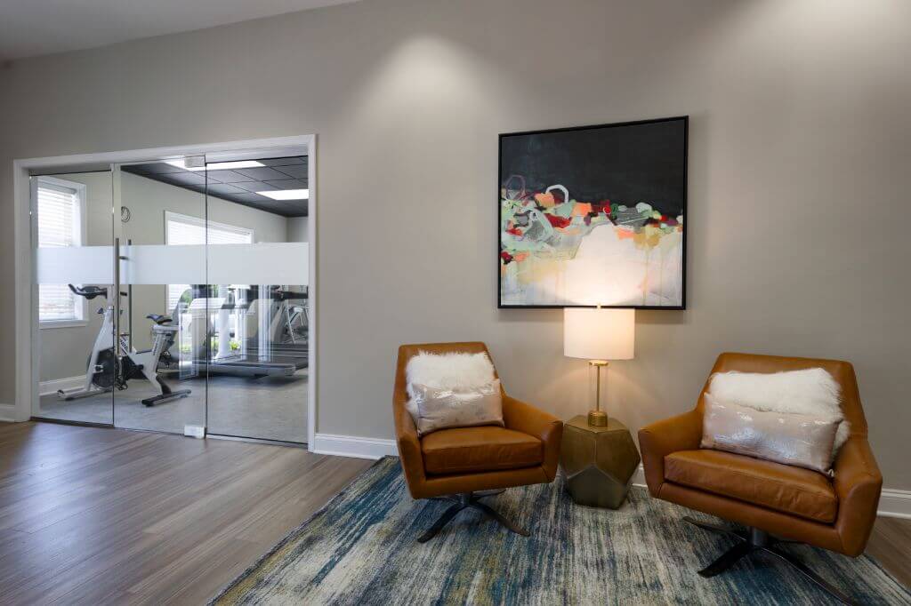 seating area outside of fitness center | Spark Waldorf Apartments