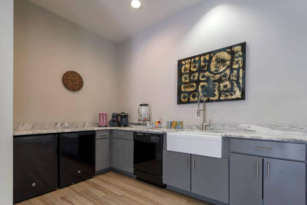 kitchen area in resident lounge | Spark Waldorf Apartments