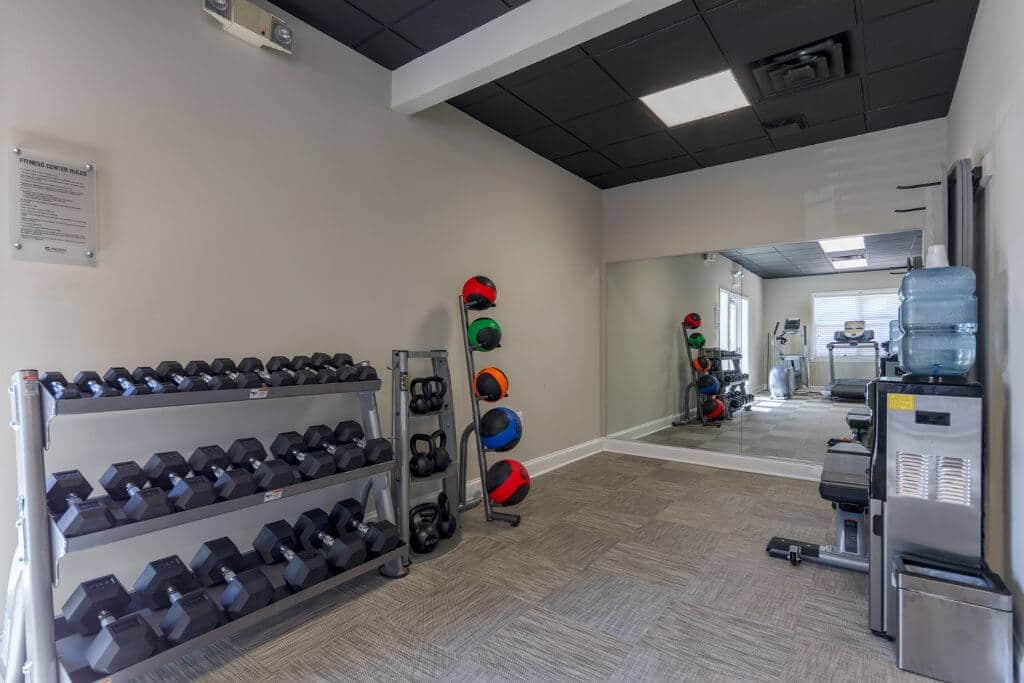 fitness center with free weights | Spark Waldorf Apartments